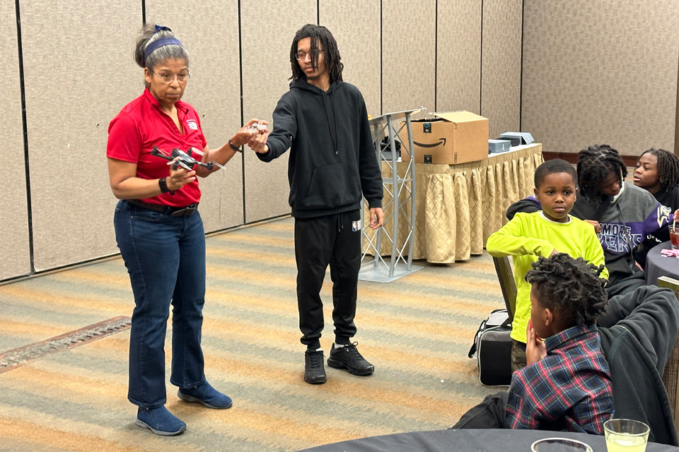 Woman and young man at St. James A.M.E. Church outreach presentation